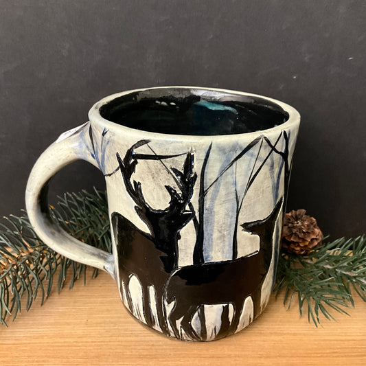 Mug Carved Deer Silhouettes with Blue Wash Background