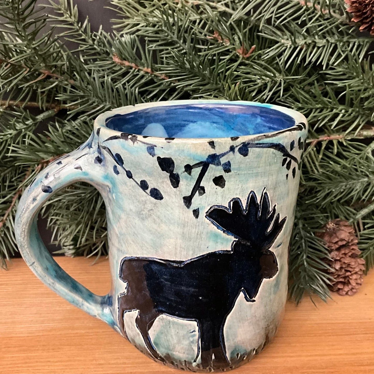 Mug with Carved Black Moose in Woods