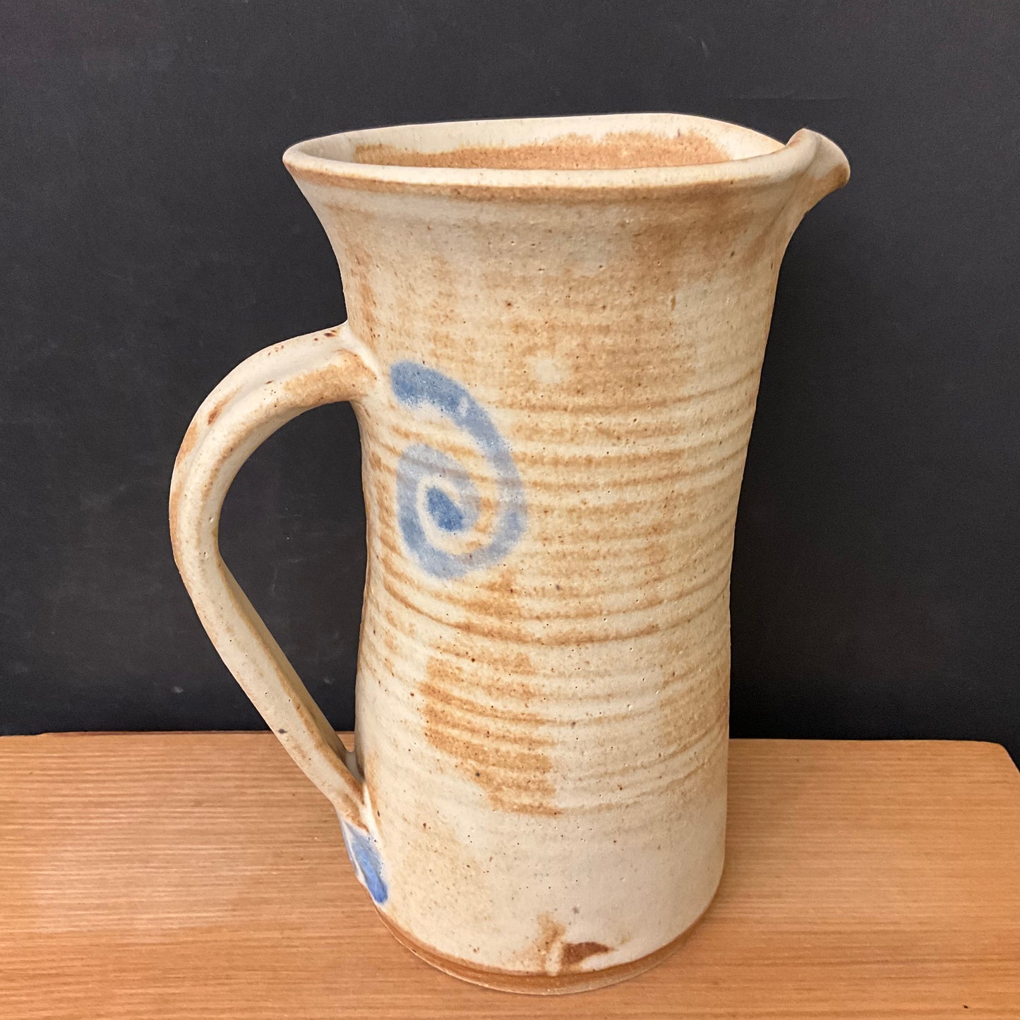 Tall Tan Pitcher with Blue Spirals