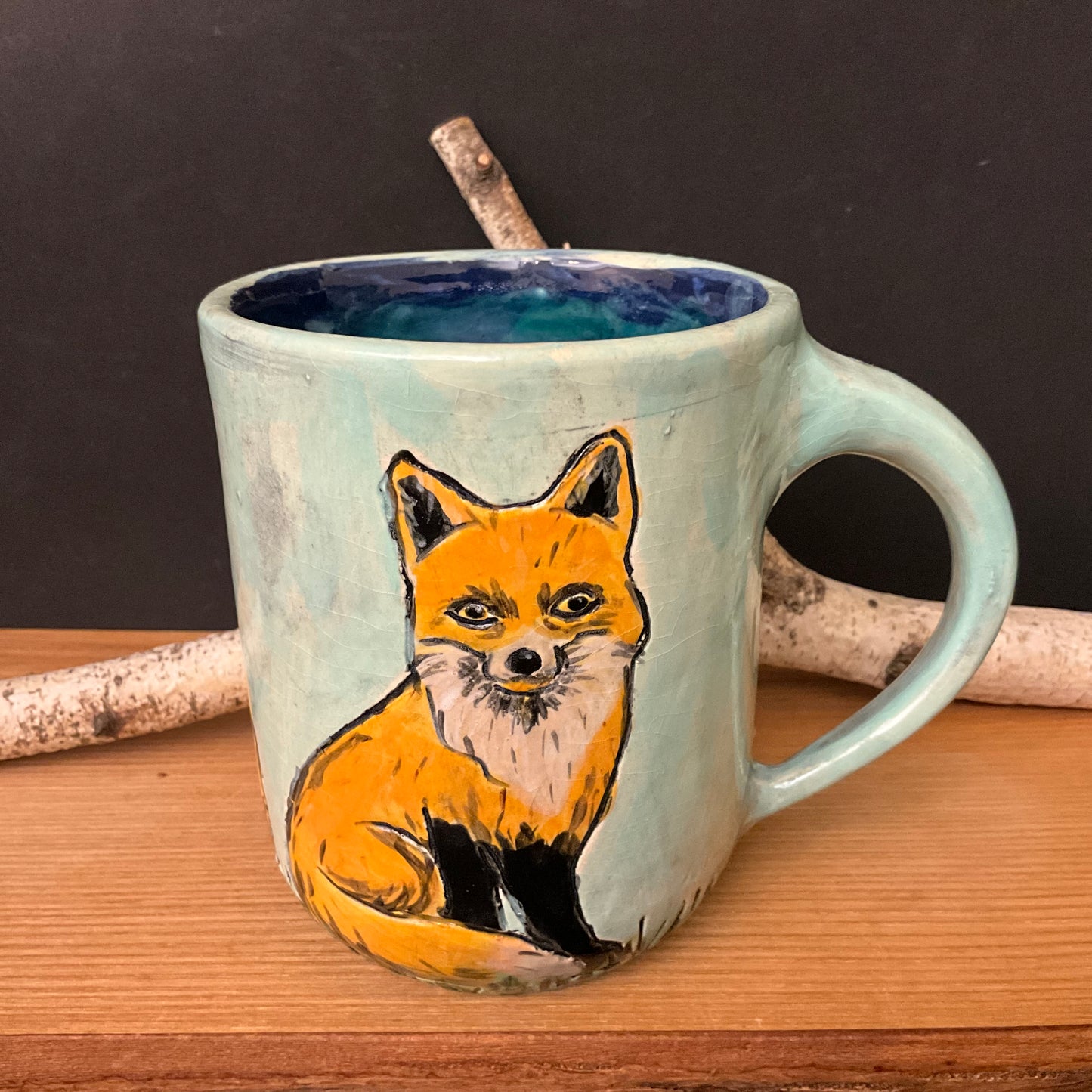 Mug with Carved Foxes