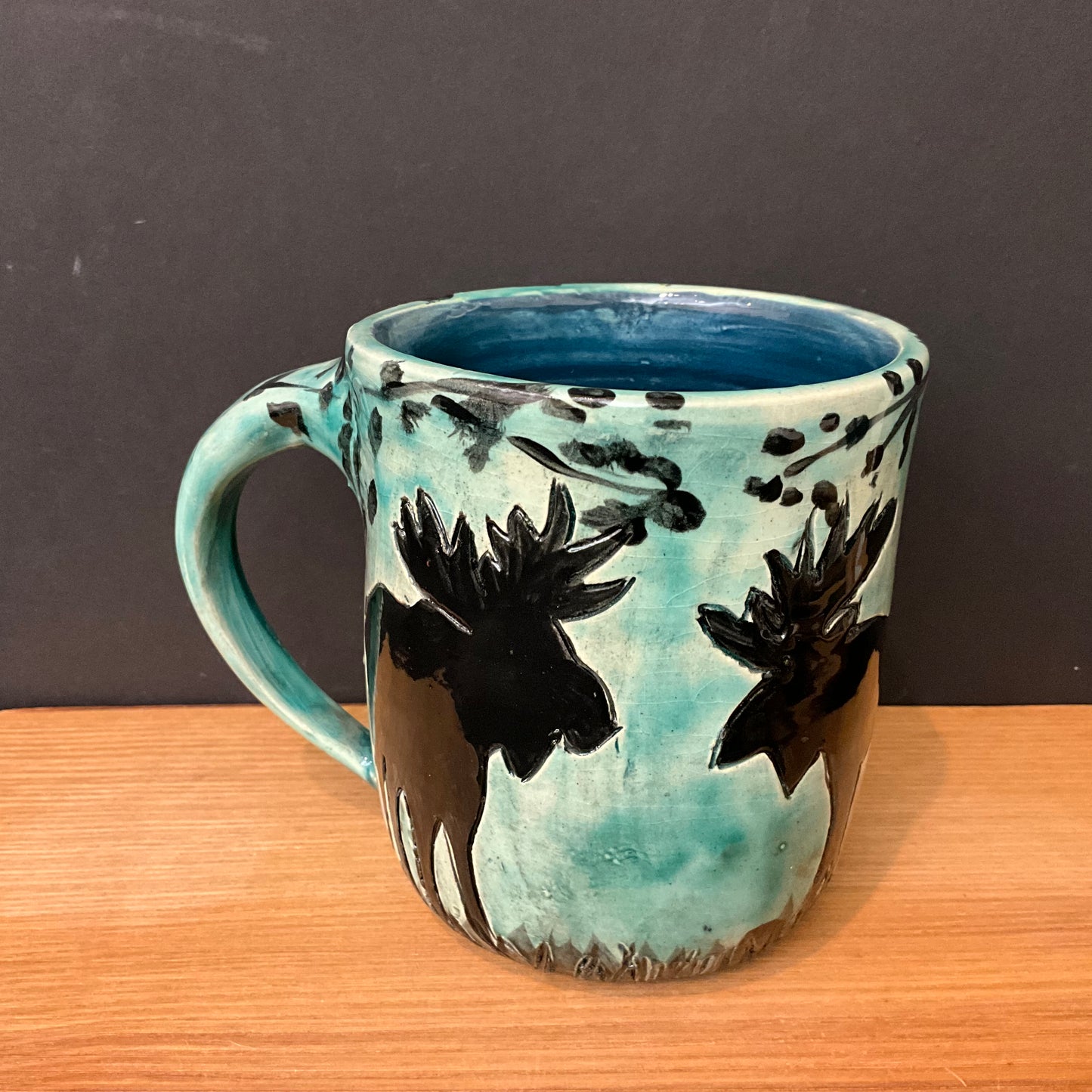 Mug with Carved Black Moose in Woods