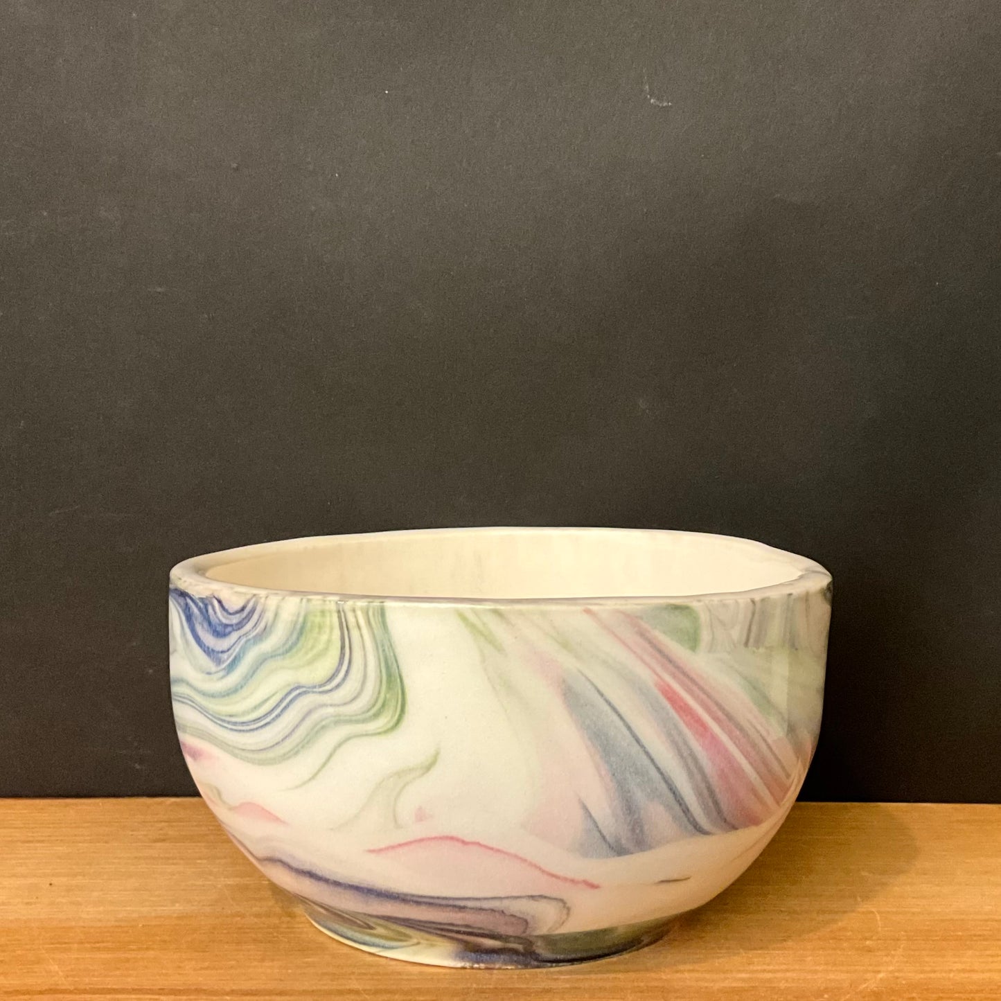 Small Porcelain Slip Bowl with Pastel Swirl Design
