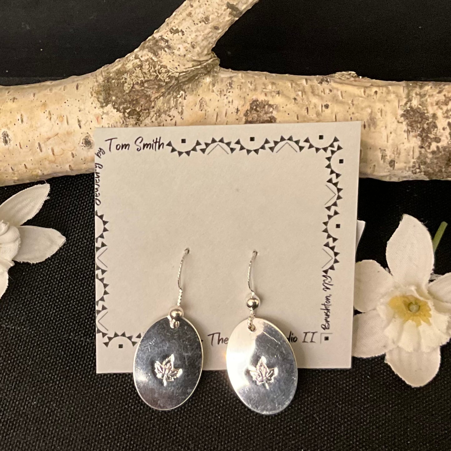 Silver Oval Drop Earrings with Stamped Maple Leaf Design