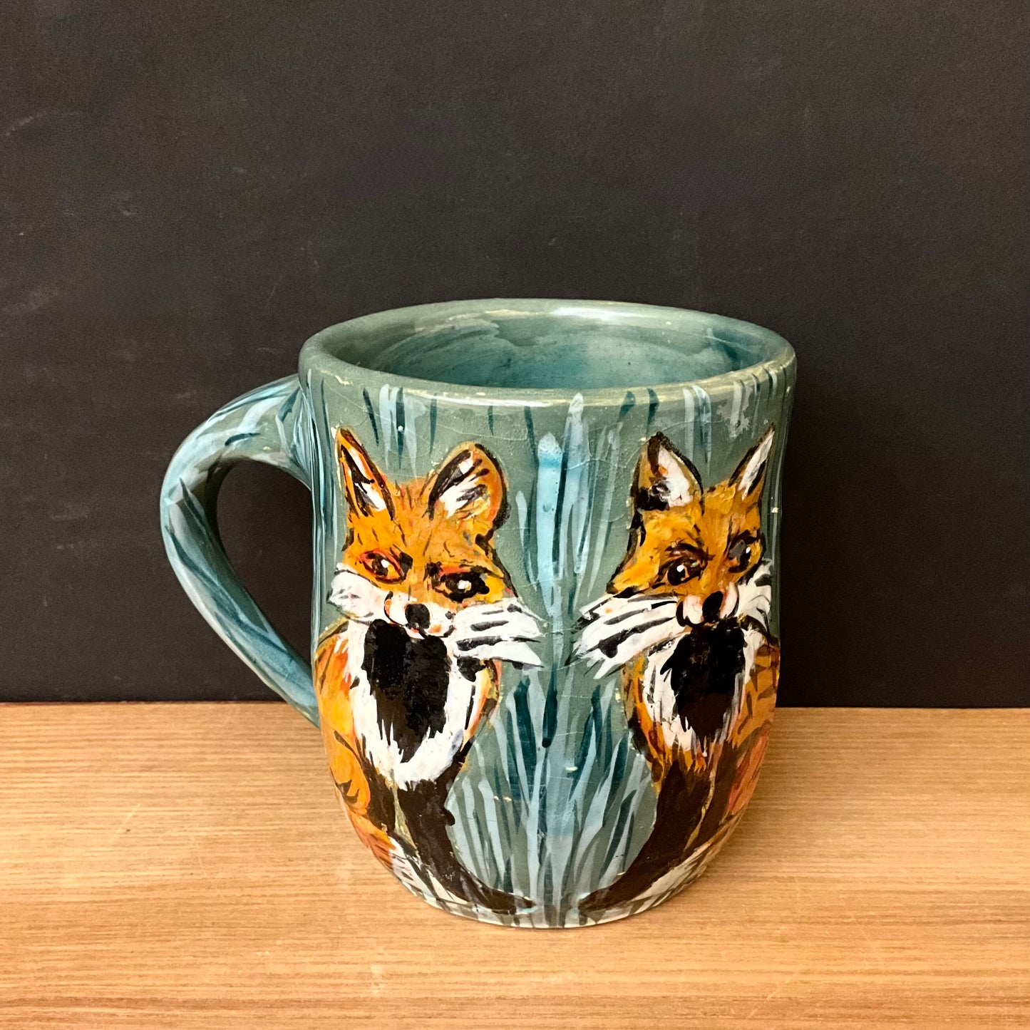 Mug with Carved Foxes