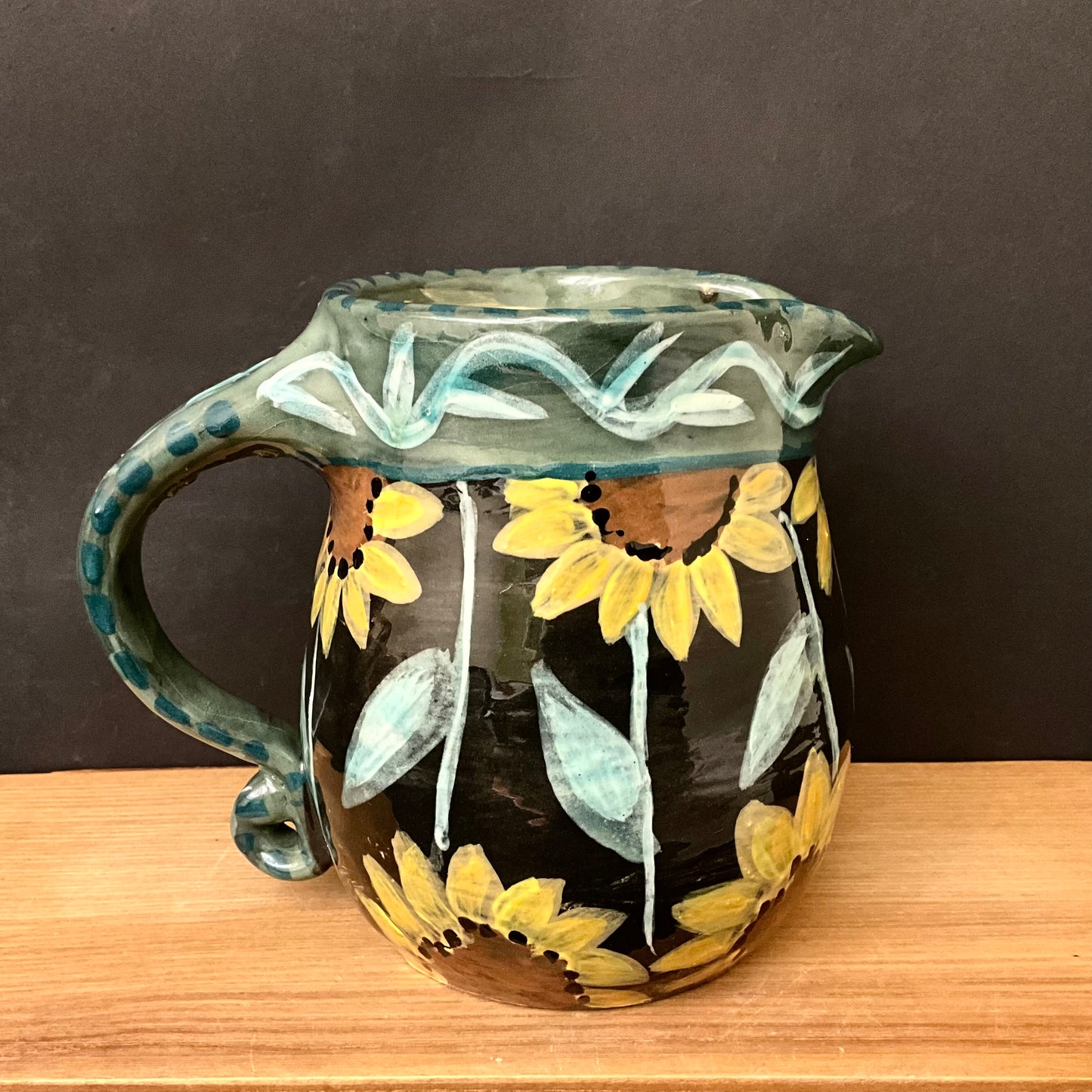 Black Pitcher with Sunflowers
