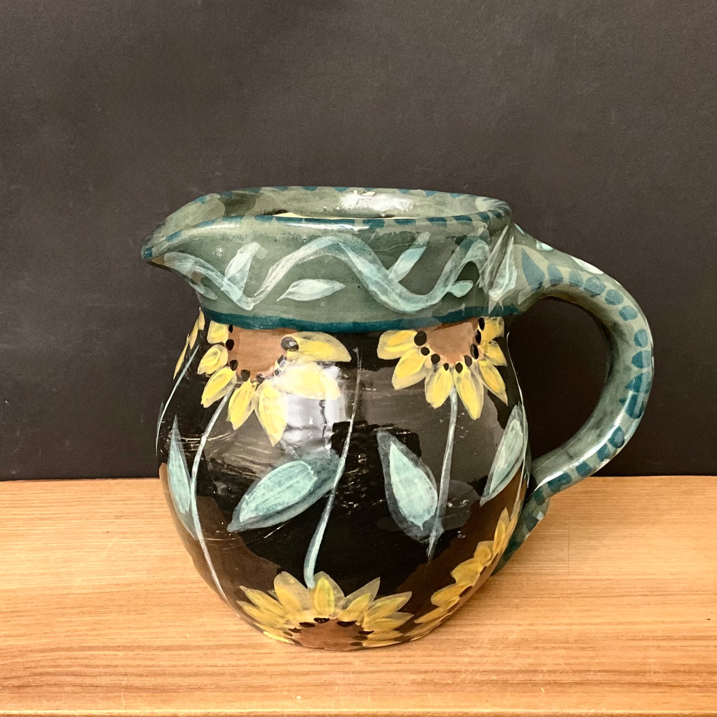 Black Pitcher with Sunflowers