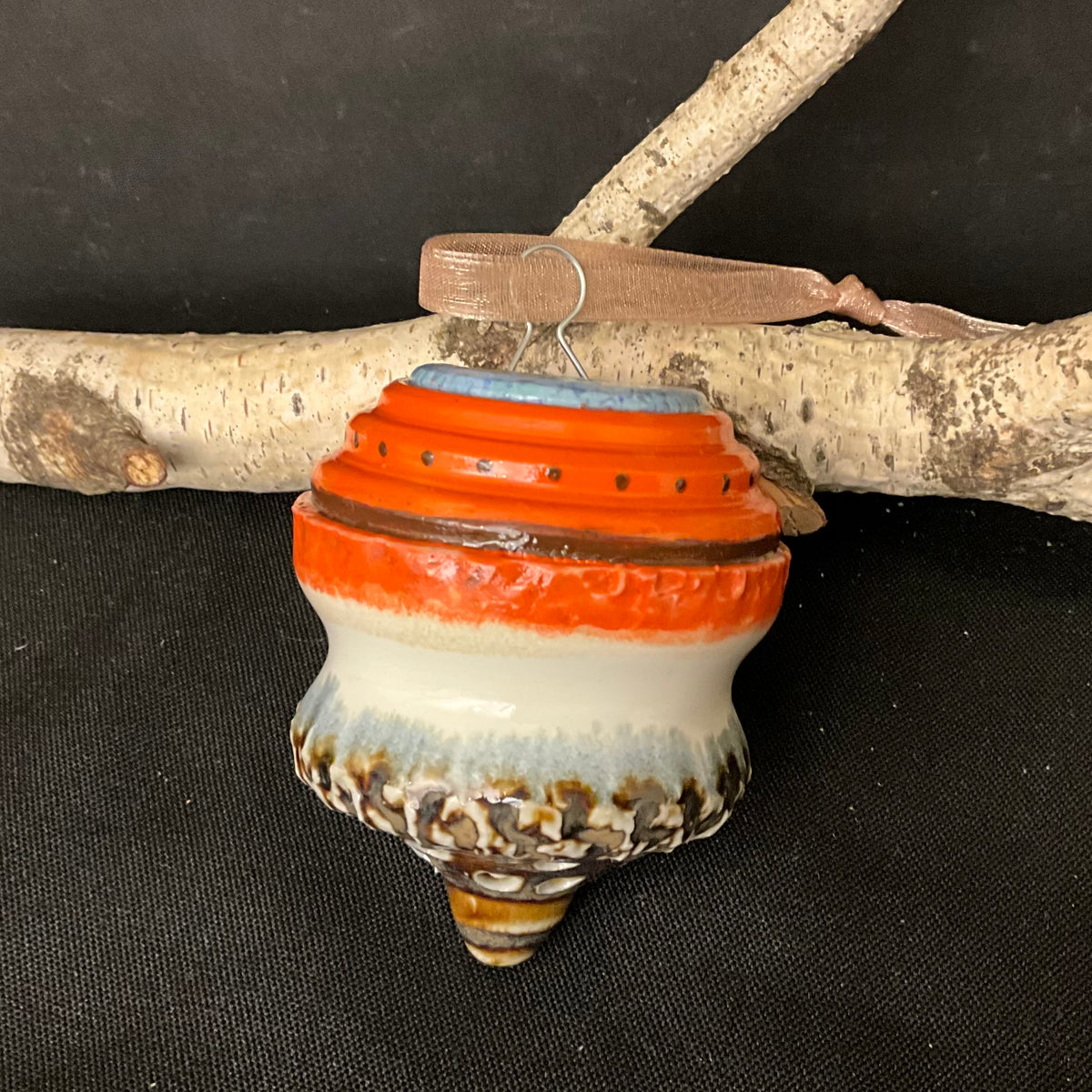 Ceramic “Top” Shaped Ornament in Orange, Blue, White & Brown