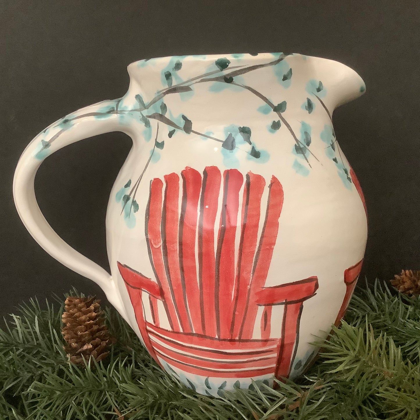 Majolica Pitcher with Red Adirondack Chairs