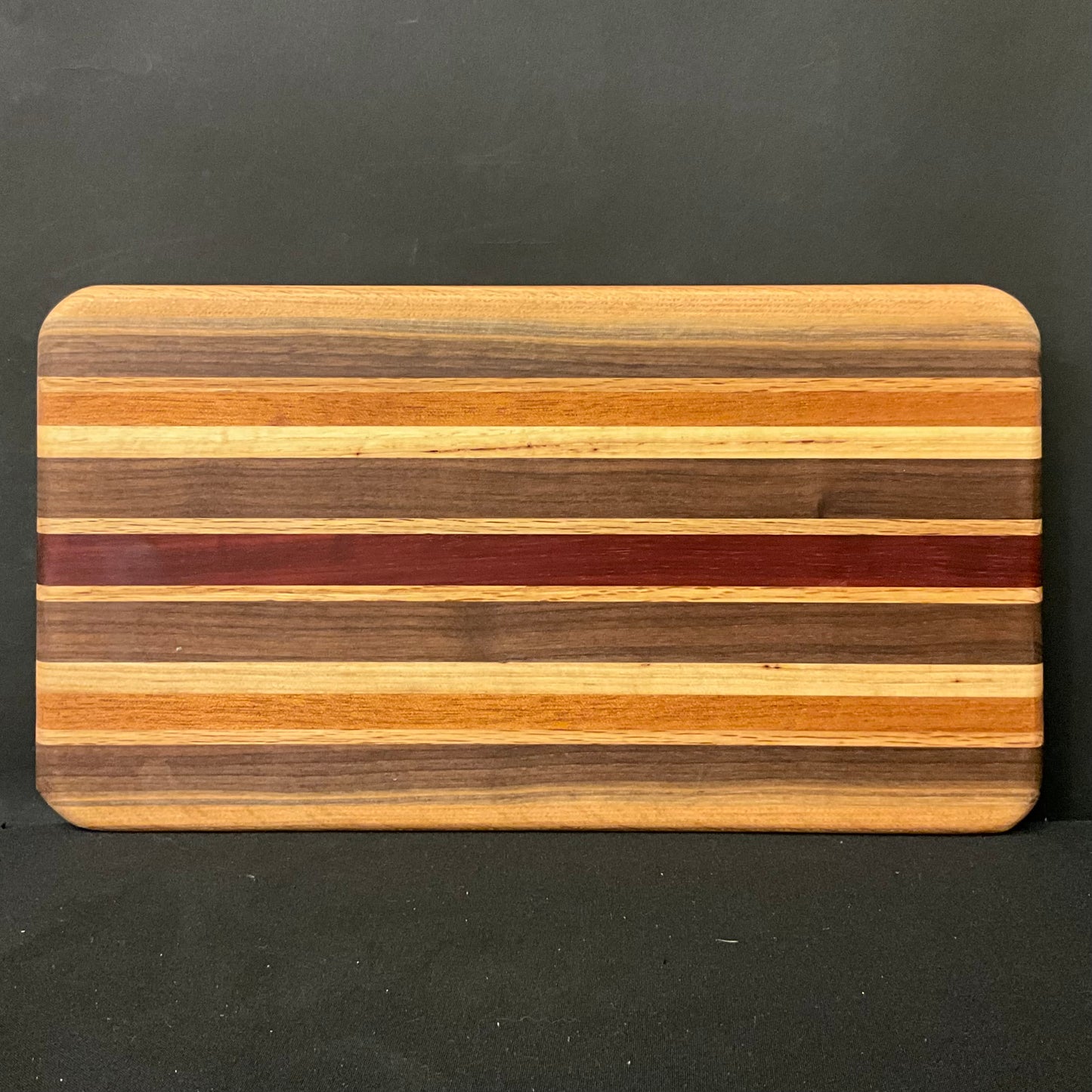 Inlaid Wood Cutting Board with Feet, mixed hardwoods