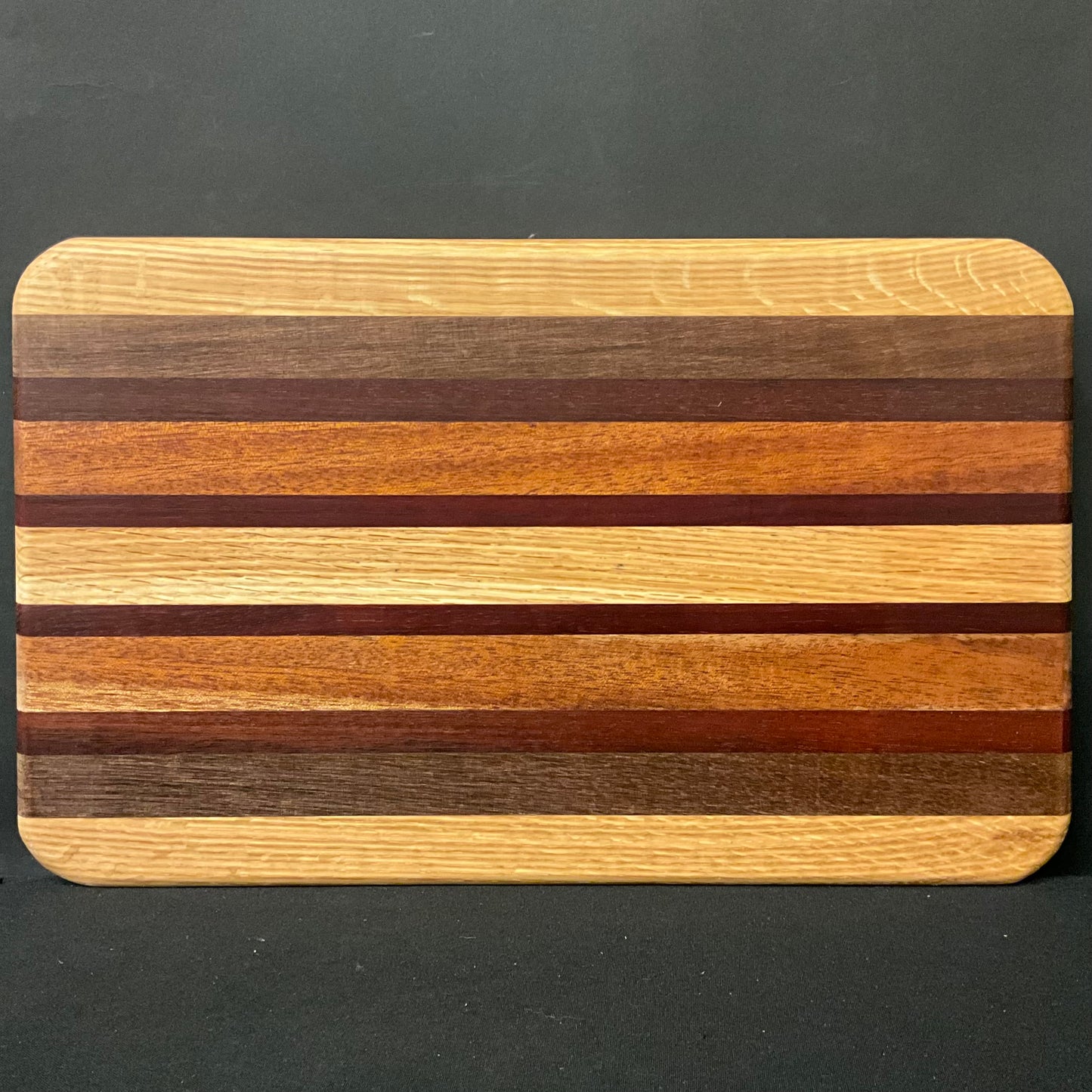 Inlaid Wood Cutting Board with Feet, mixed hardwoods