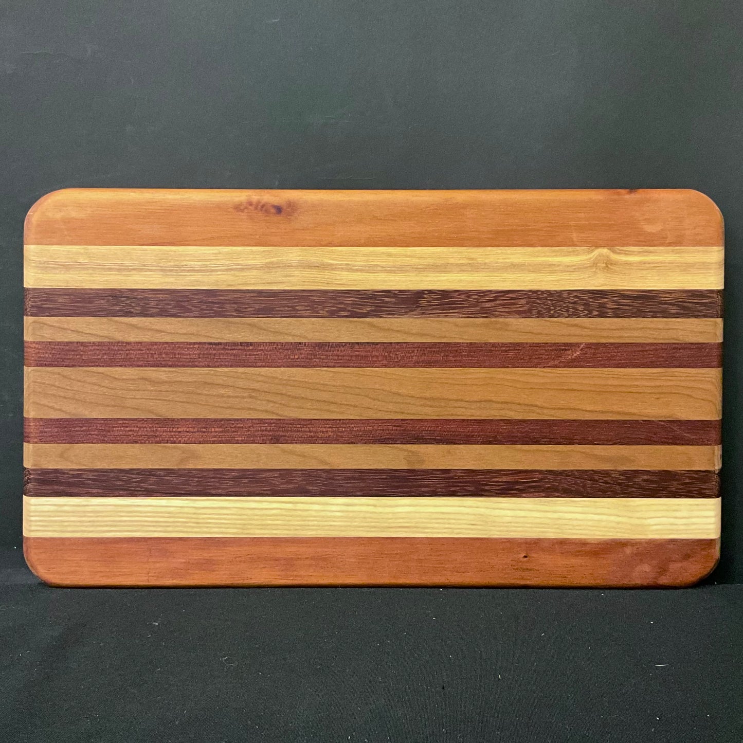 Inlaid Wood Cutting Board with Feet, mixed hardwoods