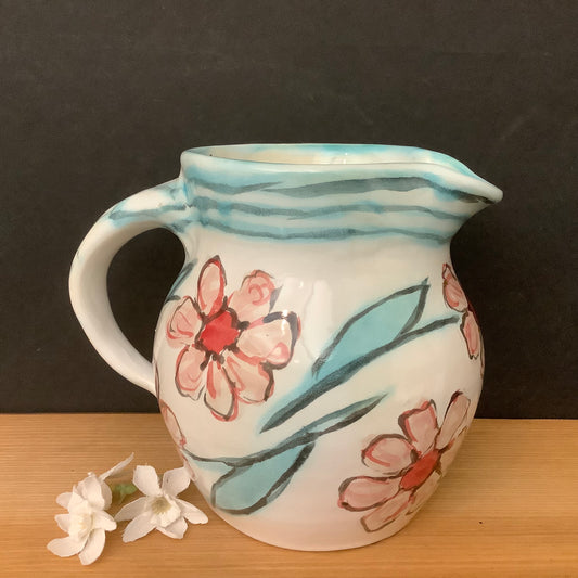 Small White Pitcher with Pale Pink Flowers
