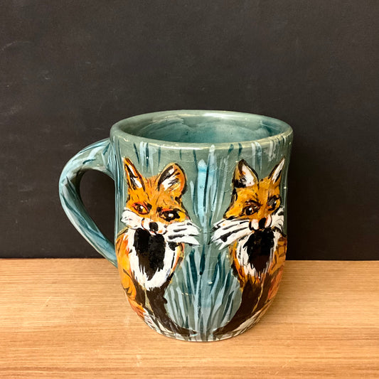 Mug with Carved Foxes