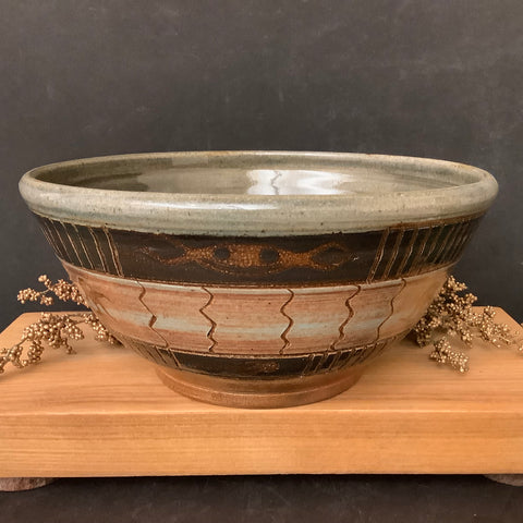 Bowl in Brown and Tan Carved Designs