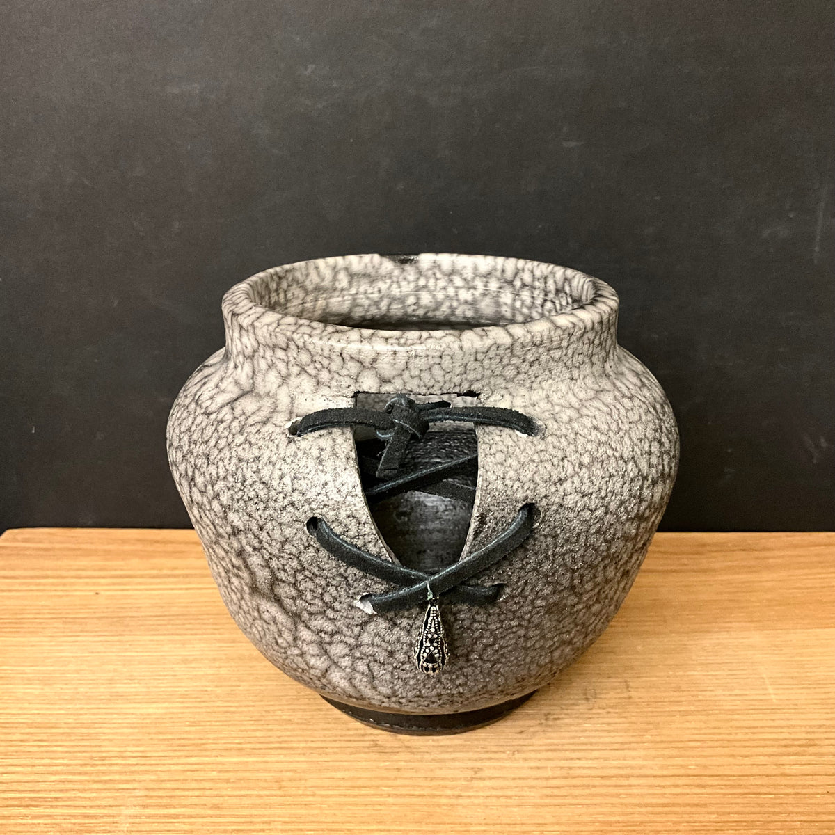 “Naked” Raku Pot with Open Front, Leather Lacing & Bead
